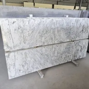 Close-up of Colonial White Granite showing natural grey mineral patterns
