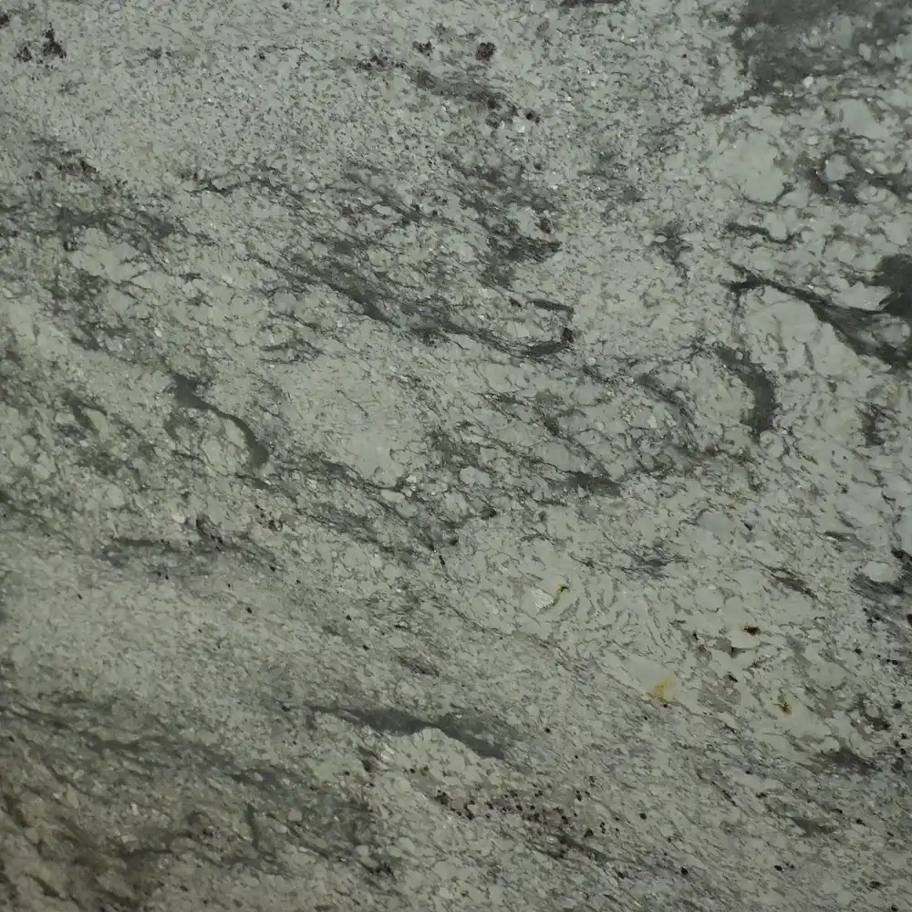 Close-up of Colonial White Granite showing natural grey mineral patterns