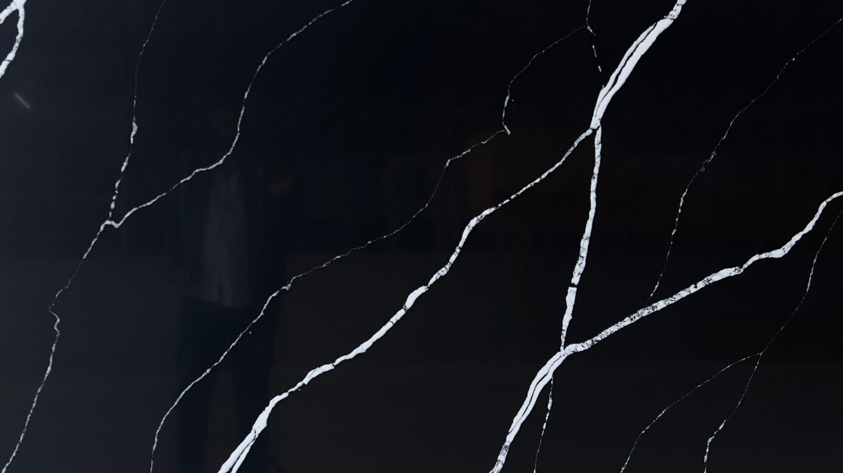 Black quartz countertop reception and kitchen island Gachibowli Hyderabad