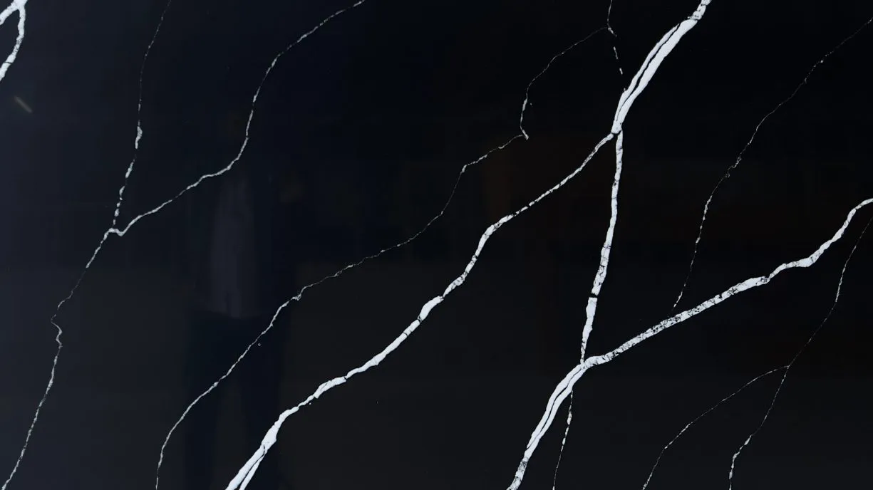 Black quartz countertop reception and kitchen island Gachibowli Hyderabad