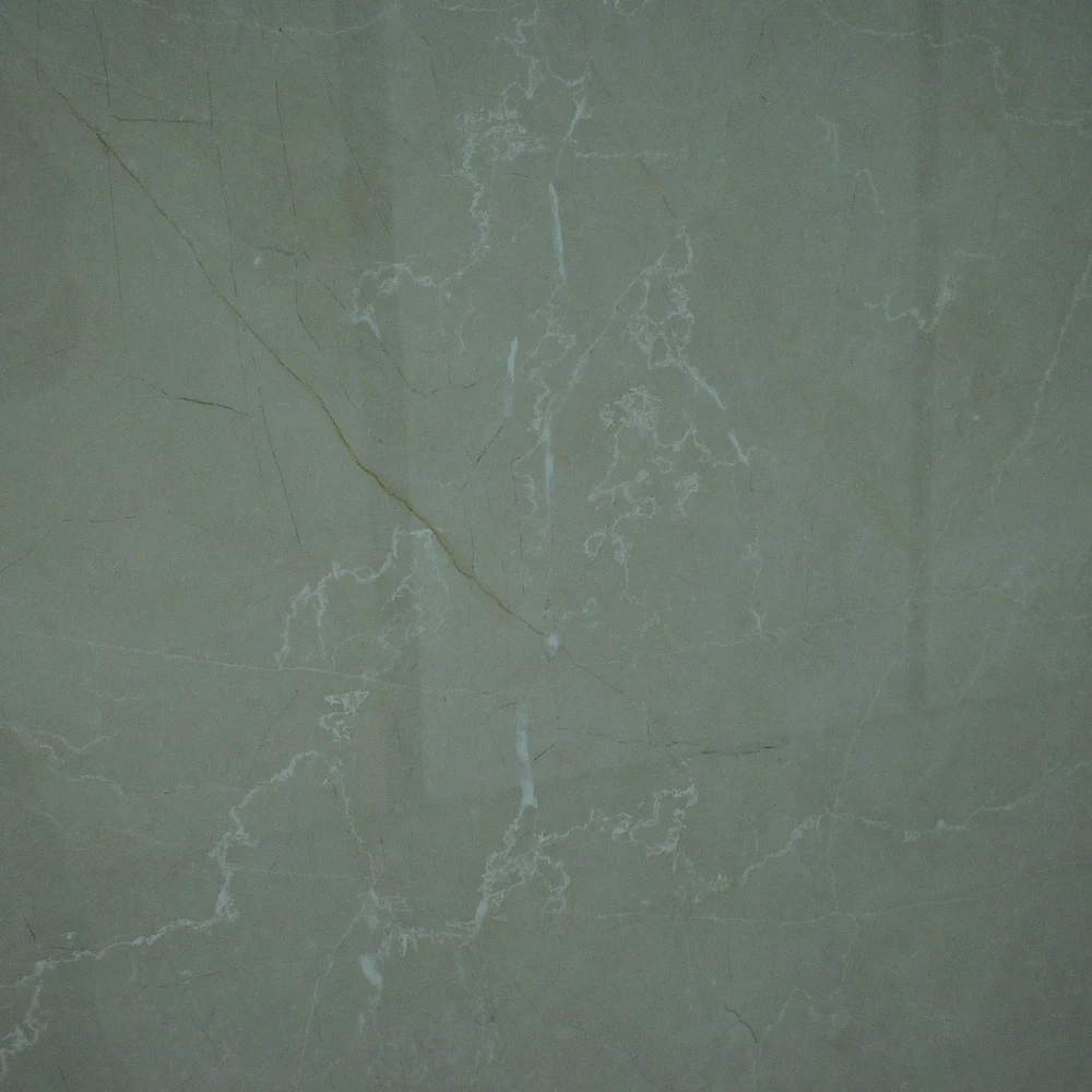 Burberry Crema Tile featuring a muted grey-green surface with natural marble-style veining