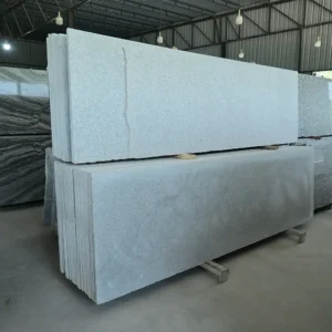 Chiku Grey Antique Granite slab with fine grey natural texture at GL Stone Expo Hyderabad