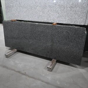 Chiku Grey Granite polished slab front view with natural black and grey grain pattern