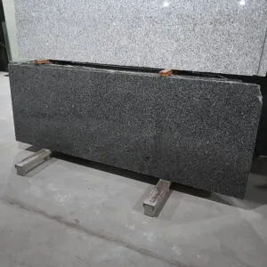 Chiku Grey Granite polished slab front view with natural black and grey grain pattern