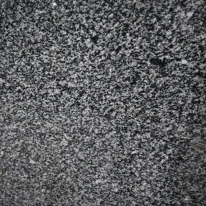 Close-up texture of Chiku Grey Granite polished surface with natural mineral pattern