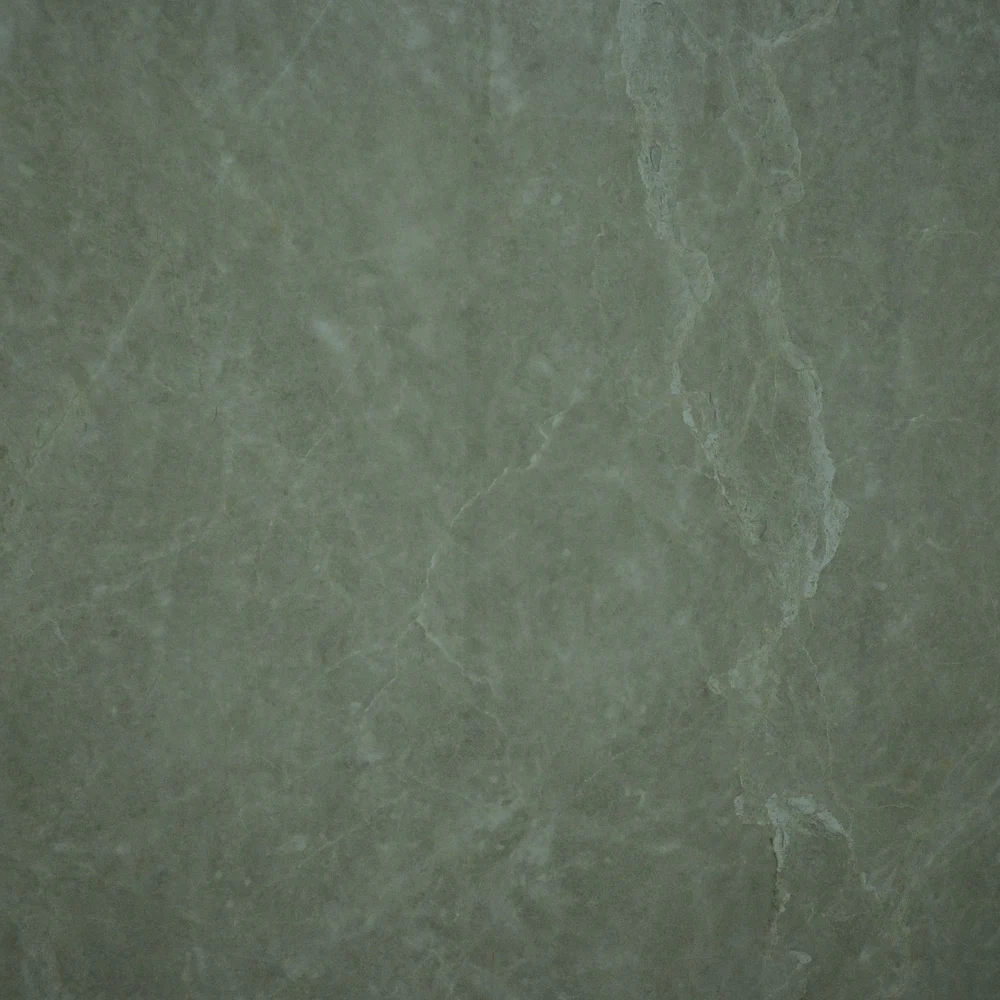 Fantasy Crema Tile featuring a muted grey-green surface with subtle natural stone patterns