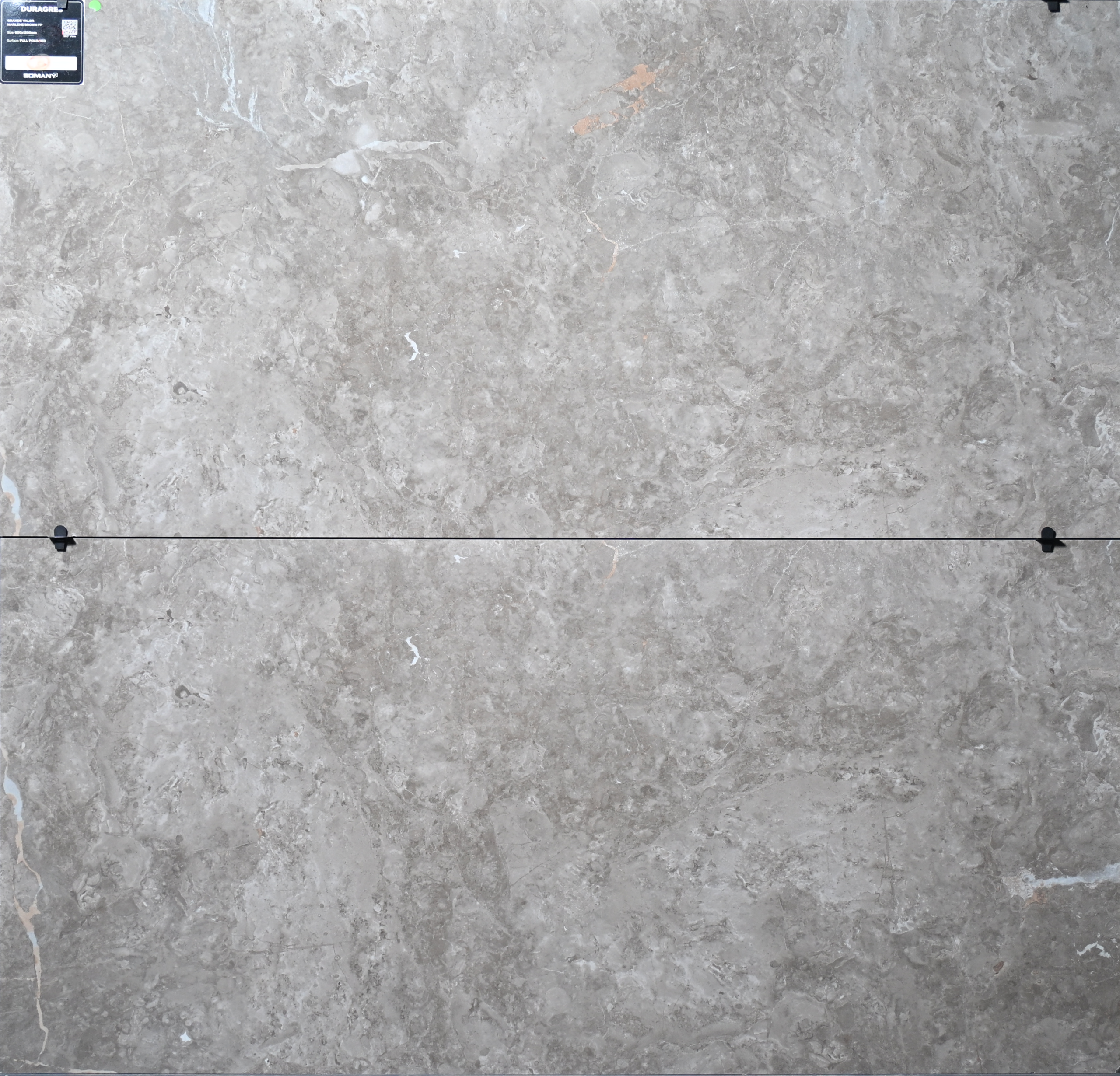 Close-up texture view of GL Stone Expo Grande Marlene Brown vitrified tile with marble finish