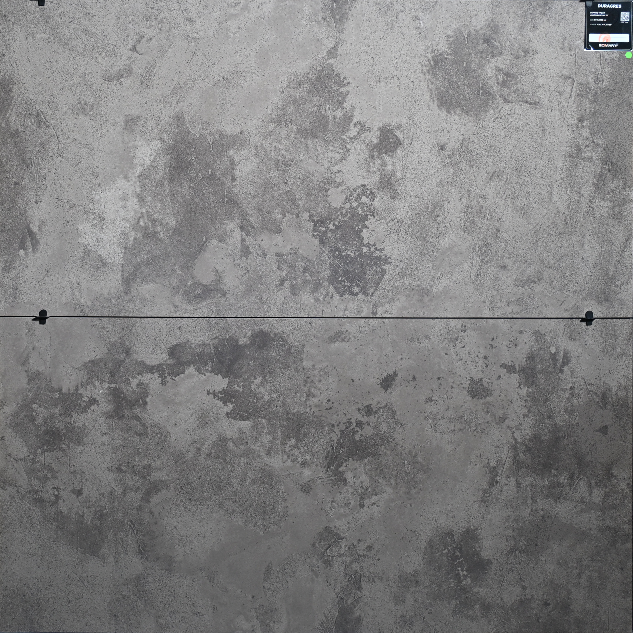 Close-up texture view of GL Stone Expo Labron Brown vitrified tile with natural stone finish