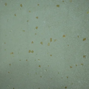 Lie Crema Tile featuring a light cream surface with subtle golden-brown speckles
