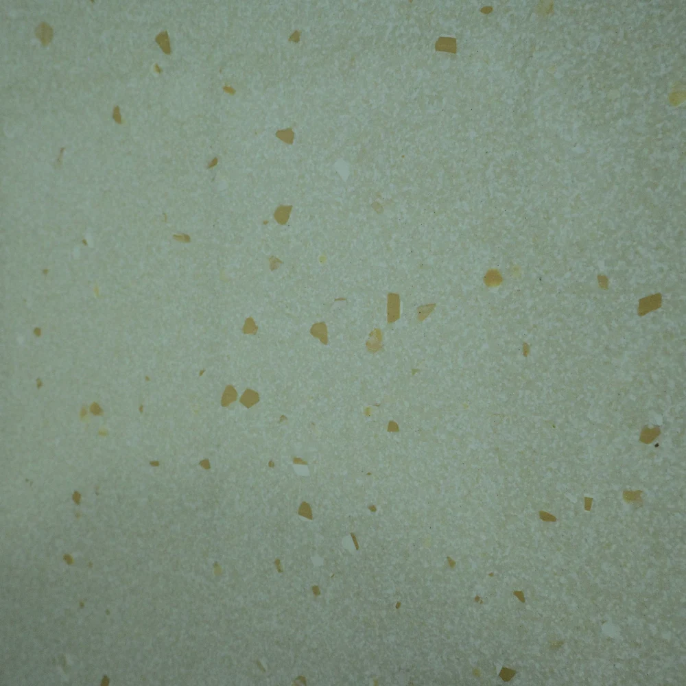 Lie Crema Tile featuring a light cream surface with subtle golden-brown speckles