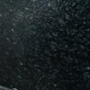 Close-up texture of Nova Black Granite with a polished natural black finish.