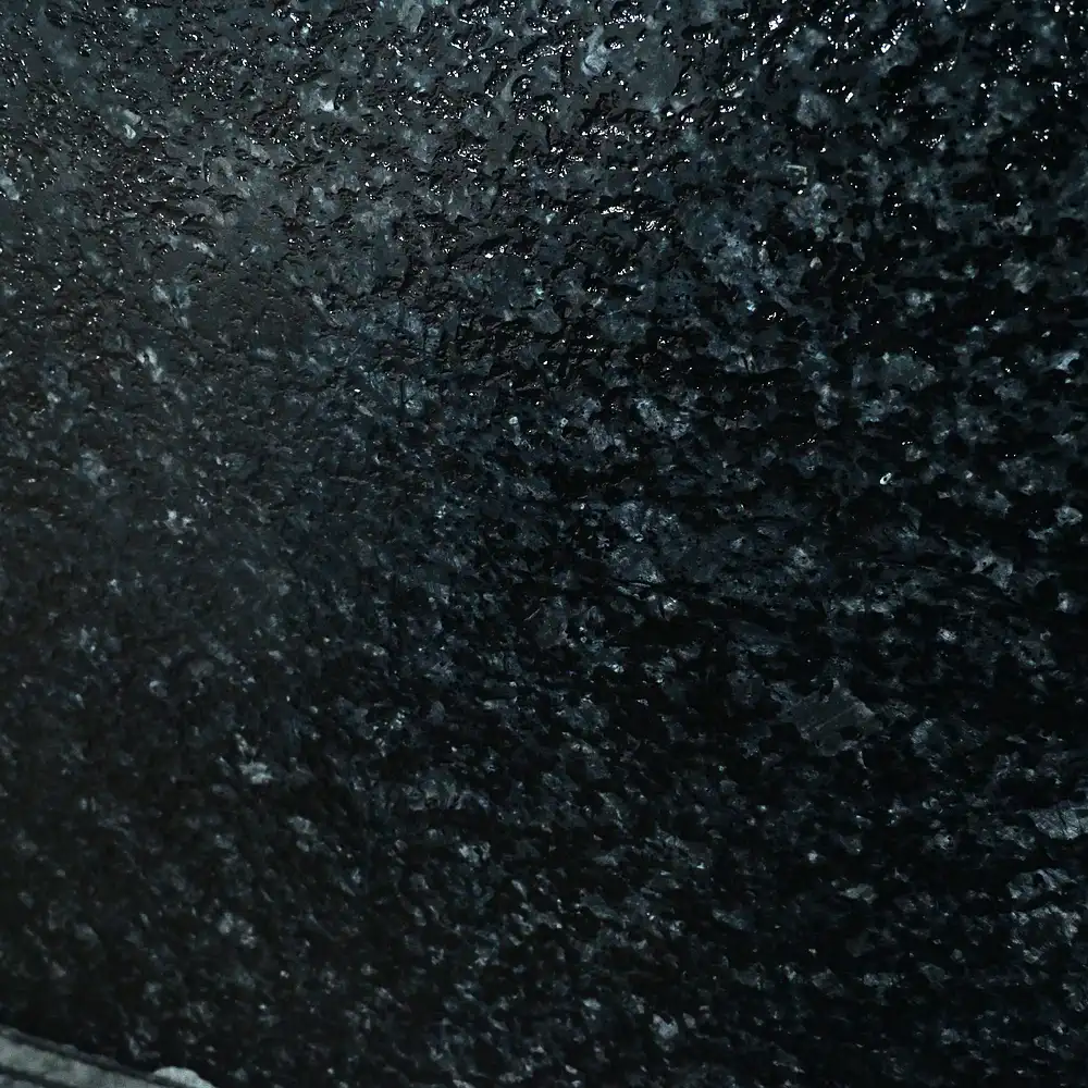 Close-up texture of Nova Black Granite with a polished natural black finish.
