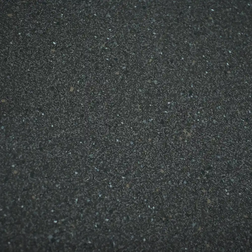 Stella Cocoa Tile featuring a dark cocoa-brown surface with fine grey and light-coloured speckles