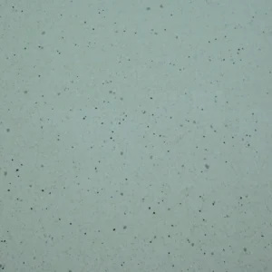Stella White Tile featuring a light white-grey surface with fine black and grey speckles