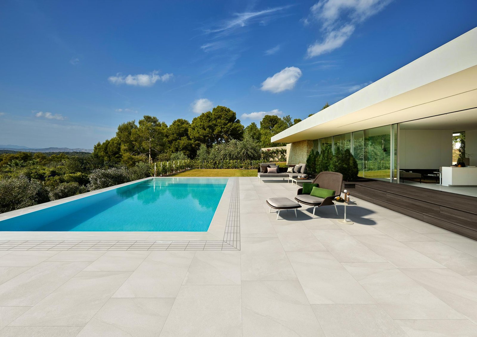 Outdoor Tiles for Modern Villas and Pool Areas Outdoor tiles around a modern villa and swimming pool